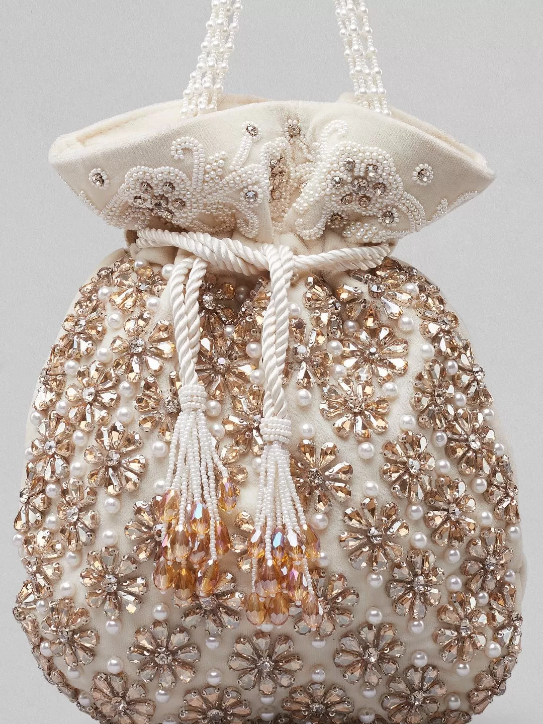 Rubans White And Golden Coloured Potli Bag With Embroided Design And Pearls.